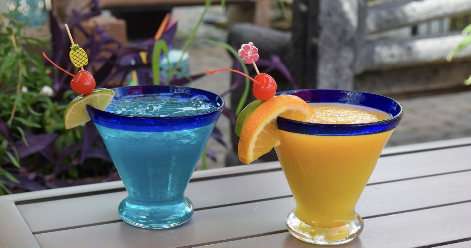 A blue margarita and a mango margarita side by side