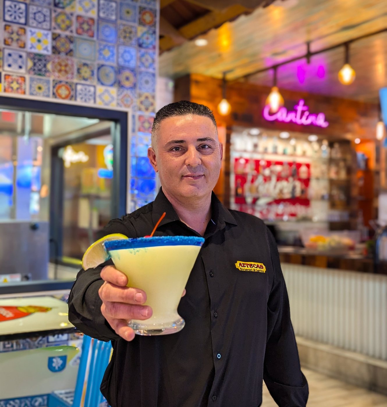 A bartender at the Airport Blvd cantina